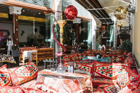 Create a cozy cafe space with traditional Indian prints and ethnic decor